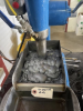 Figure 2; Photo of flotation testwork underway on test R02. Note grey colour of the bubbles is due to stibnite.