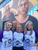 Photo 2: Courtney Ugle (centre) standing in front of her painted image on the Bundah Sports Centre mural with Got Your Back Sista General Manager, Joanne Buckingham (left) and Founder Melissa Histon (right).