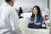 A pharmacist advises a consumer on the purchase of Haleon's Otrivin nasal mist.