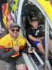 Connor sits in V8 SuperUte driver Jimmy Vernon's race car during a respite weekend