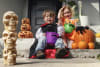 Harper and Harvey trick-or-treating with Coles Halloween range	
