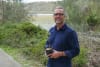UNSW Water Research Laboratory's Professor William Glamore with a mangrove sapling. These trees are a vital part of storing carbon in wetland and coastal environments.  CREDIT: Jacob Gillard/UNSW